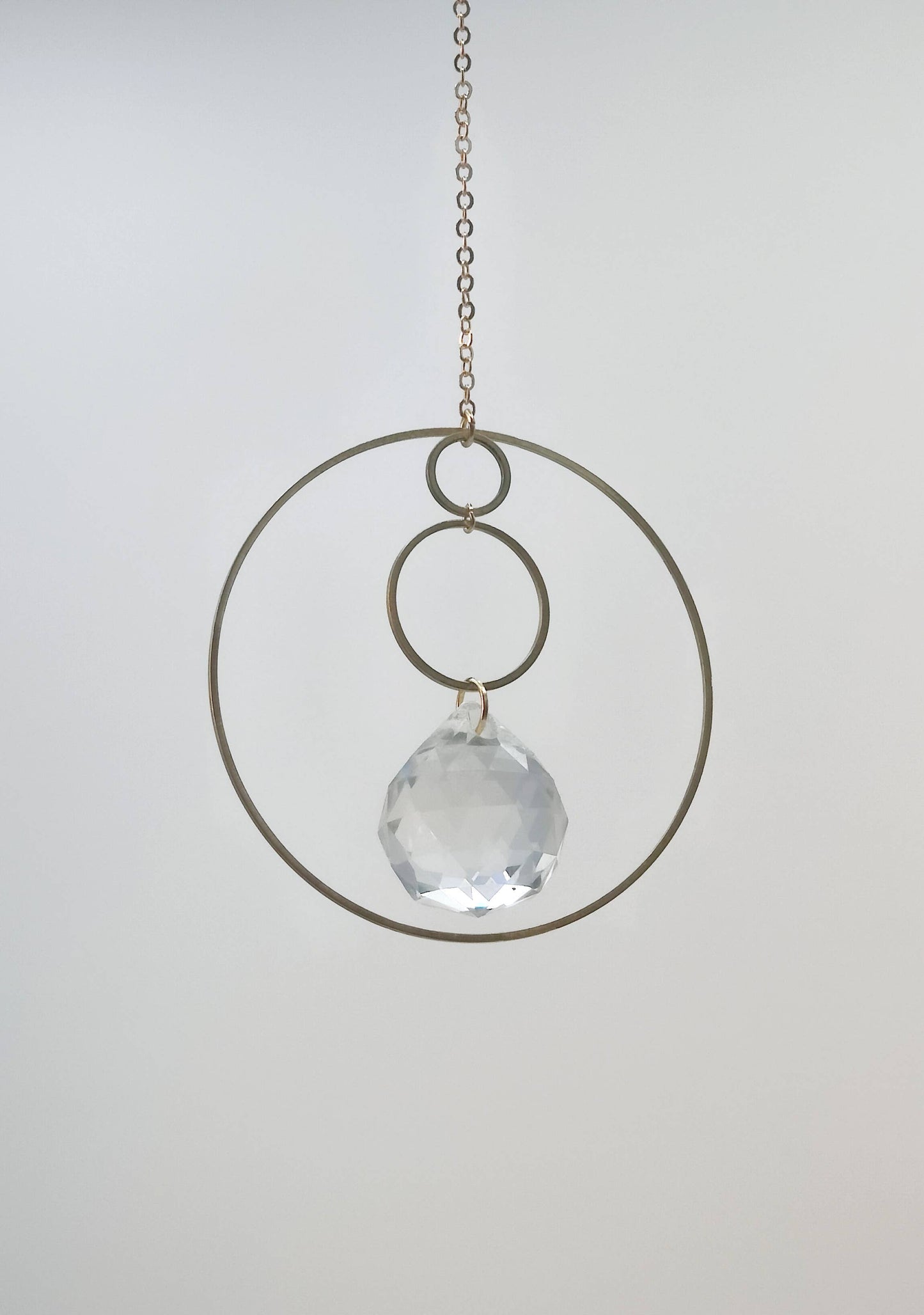 GEO suncatcher in brass and glass crystal